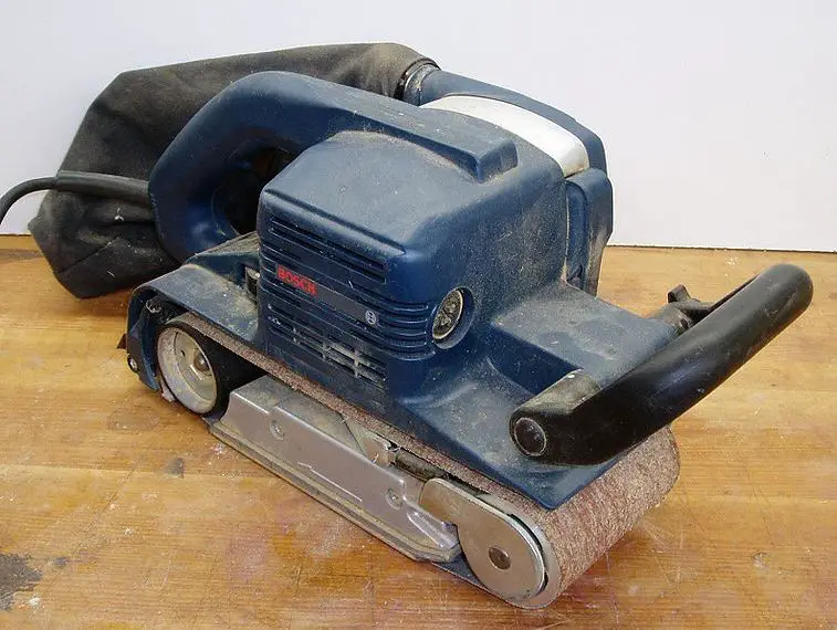 Sanding Floor with Hand Belt Sander